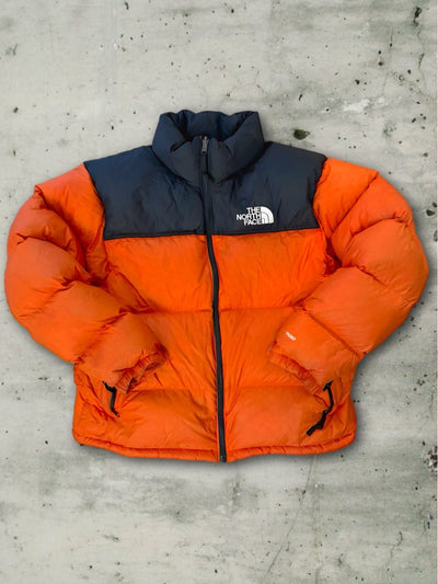 Piumino The Noth Face vintage 700 tg L arancione Thriftmarket BAD PEOPLE